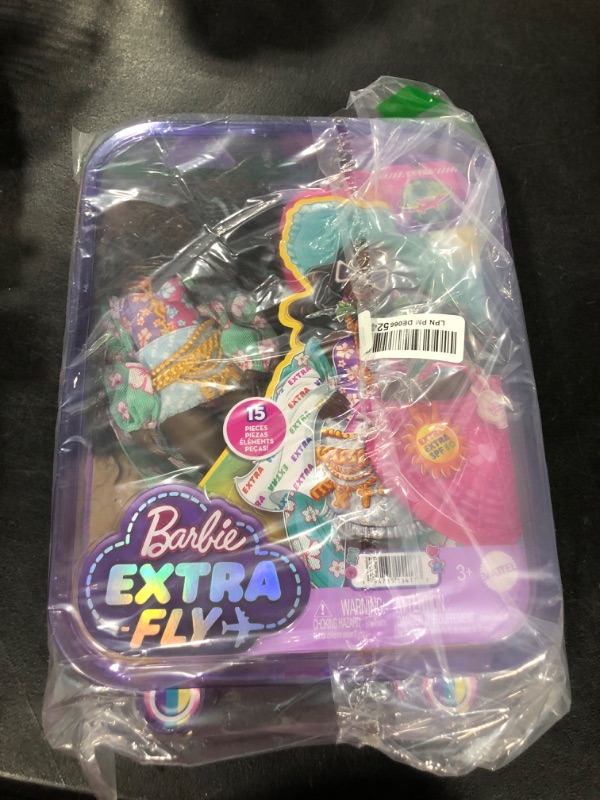 Photo 1 of Barbie Extra Fly Doll with Beach-Themed Travel Clothes & Accessories, Tropical Coverup with Oversized Hat & Bag