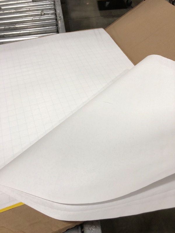 Photo 4 of Post-it, MMM560, Faint Grid Self-stick Easel Pads ___ Minor damage pictured - Blade cuts down to the third sheet