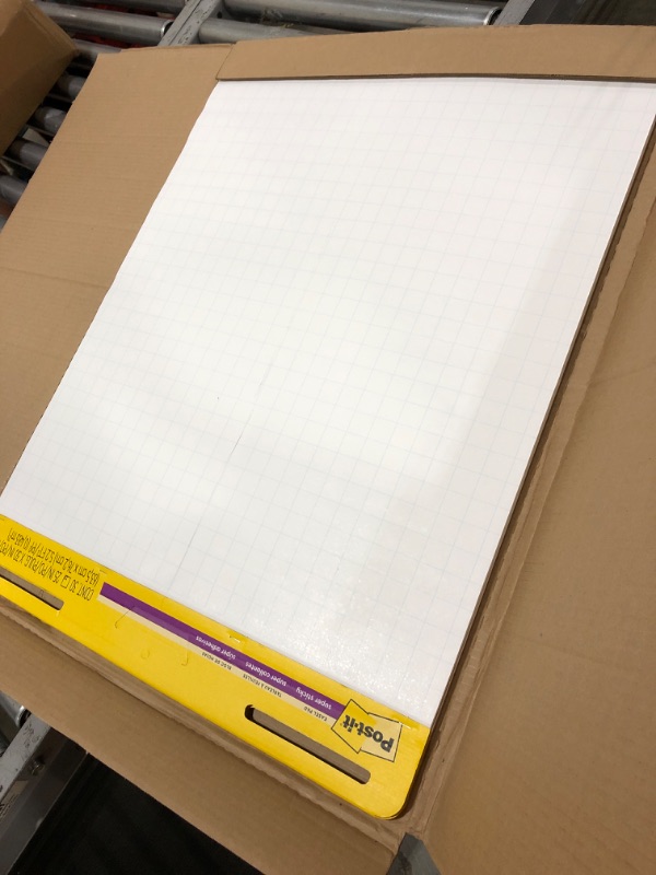 Photo 2 of Post-it, MMM560, Faint Grid Self-stick Easel Pads ___ Minor damage pictured - Blade cuts down to the third sheet