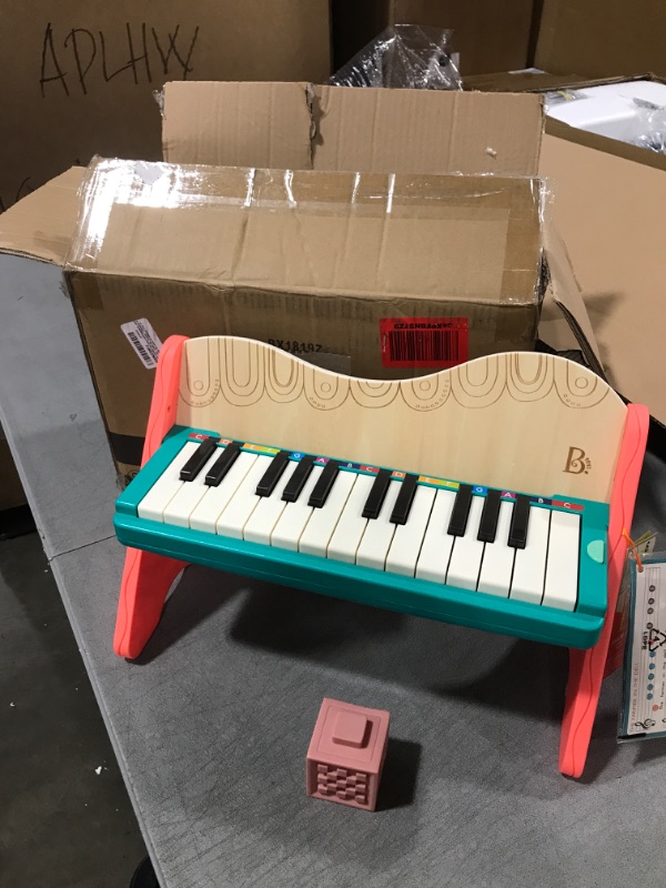 Photo 2 of B. toys wooden toy piano with songbook, piano wooden toy, music toy, musical instrument to learn to play the piano for children from 3 years old.