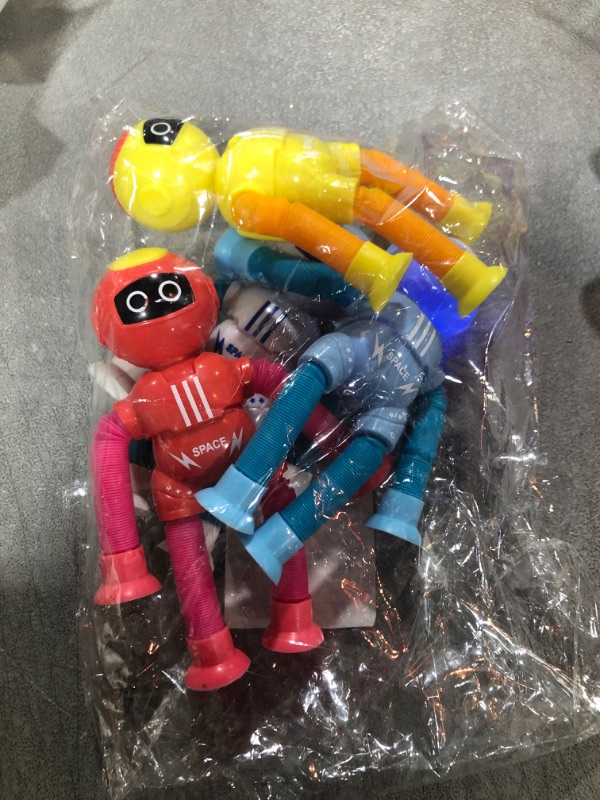 Photo 2 of Bendable Robot Figures Set of 4, Flexible Suction Cup Men, Fidget Pop Tubes Sensory Toys for Girls and Boys \