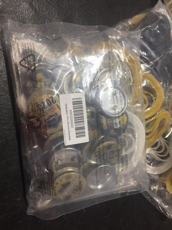 Photo 1 of 2023 grad  pins  and bracelets pack 