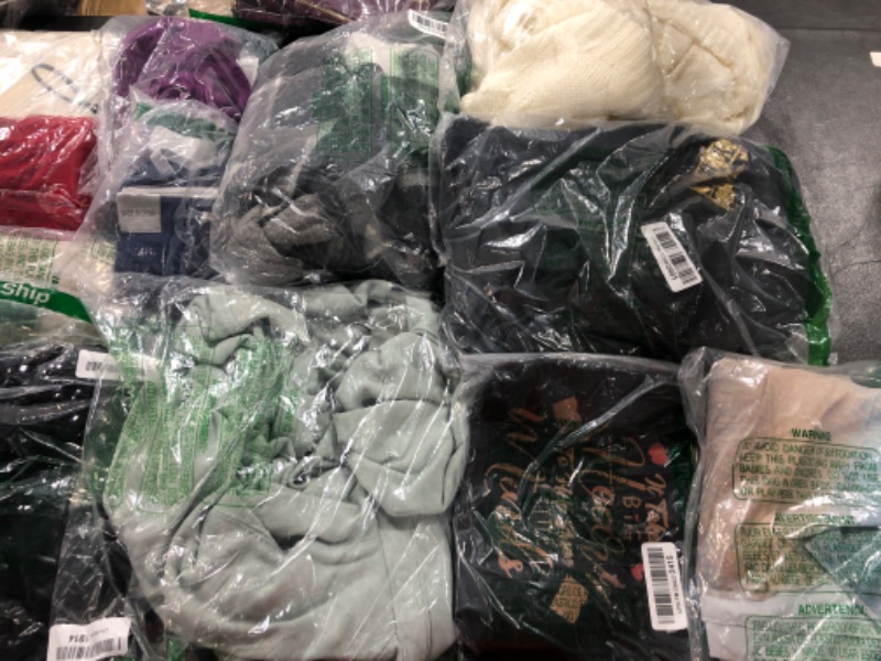 Photo 1 of BOX OF CLOTHES 
DIFFRENTS STYLES AND SIZES 