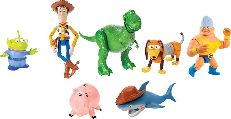 Photo 1 of Disney and Pixar Toy Story Set of 7 Action Figures with Woody, Slinky, Rex, Hamm, Alien, Rocky & Shark, Disney100 Collectible (Amazon Exclusive)
