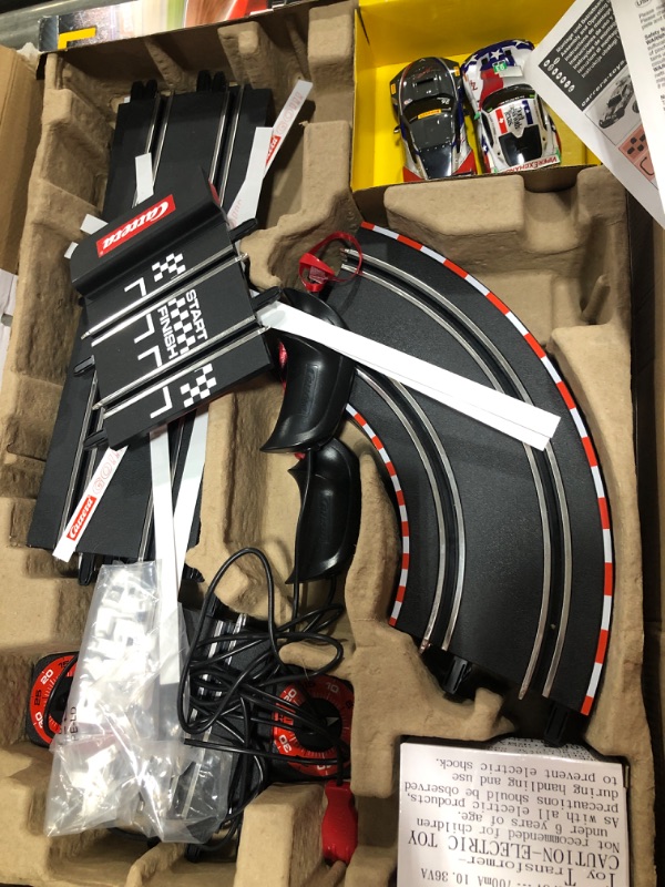 Photo 1 of Carrera GO!!! 62521 onto The Podium Electric Powered Slot Car Racing Kids Toy Race Track Set Includes 2 Hand Controllers and 2 Cars in 1:43 Scale