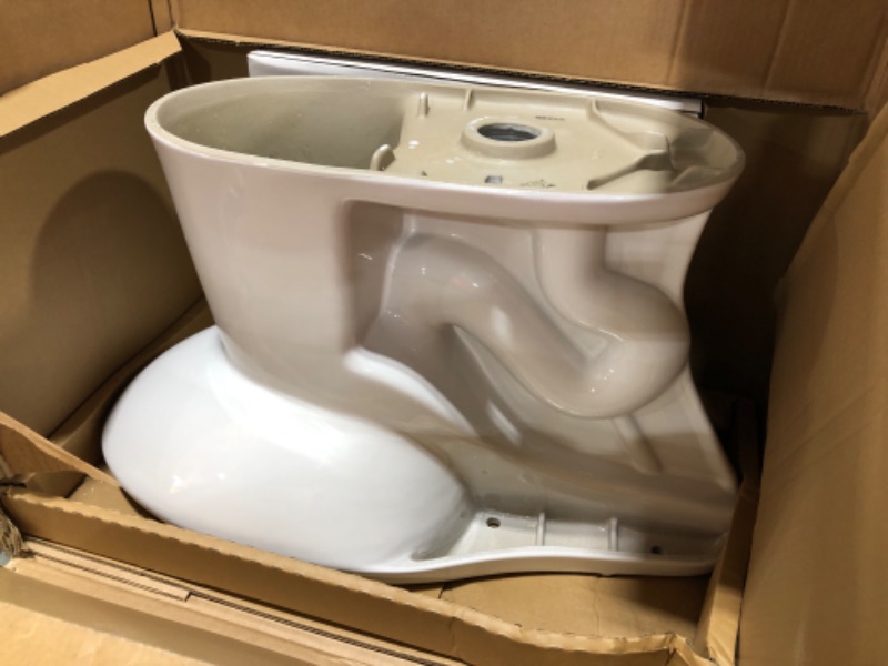 Photo 2 of 2-piece 1.1 GPF/1.6 GPF High Efficiency Dual Flush Complete Elongated Toilet in White, Seat Included
