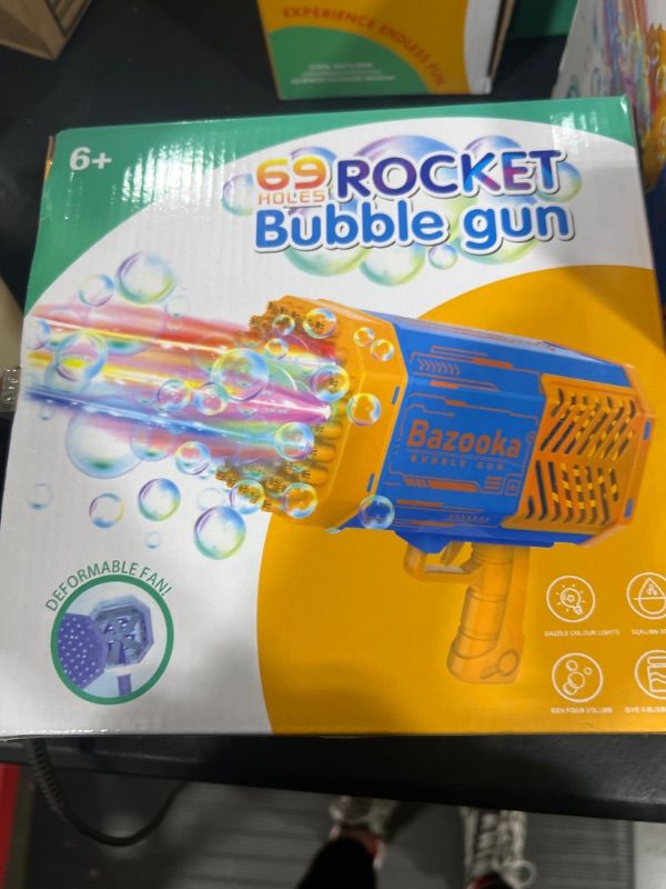 Photo 2 of Bubble Machine Gun for Toddlers Rocket Boom 69 Holes Bubble Gun Blower Blaster for Kids Ages 6-12 Girl Boy Summer Outdoor Birthday Wedding Party Bubble Makers Toys Gift for 6 7 8 9 10 Year Old Blue