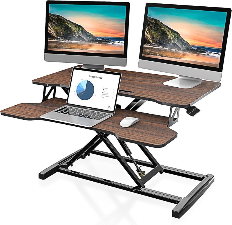 Photo 1 of  FITUEYES Height Adjustable Standing Desk 32” Wide Sit to Stand Converter Stand Up Desk Tabletop Workstation for Laptops Dual Monitor Riser Brown SD308002WE 