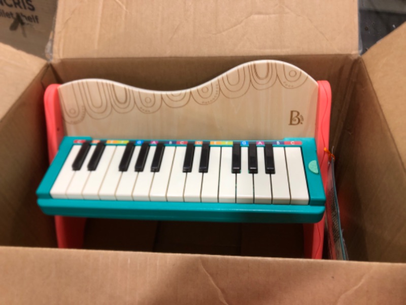 Photo 2 of B. toys wooden toy piano with songbook, piano wooden toy, music toy, musical instrument to learn to play the piano for children from 3 years old.