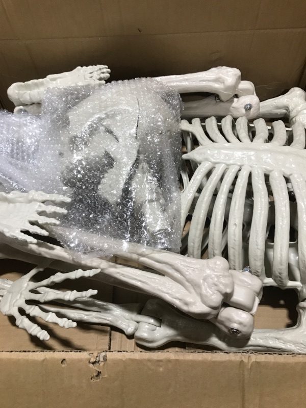 Photo 2 of JOYIN 5.6 FT Halloween LED Life-Size Skeleton Full Body Human Bones with Red Light Eyes and Posable Joint for Spooky Indoor and Outdoor Settings, Haunted House Accessories