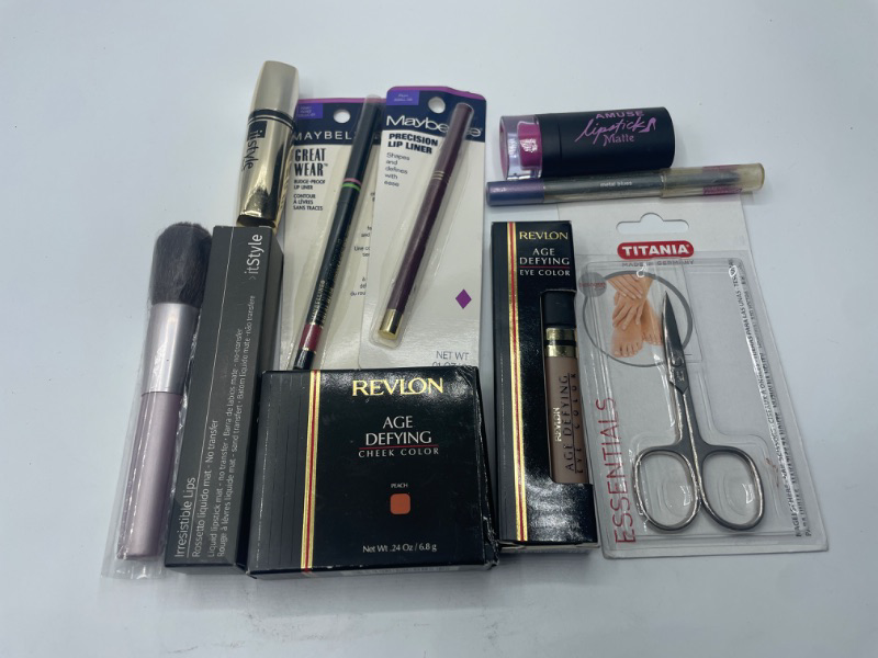 Photo 1 of Miscellaneous variety brand name cosmetics including (Titania, Maybelline, Revlon , It style & discontinued makeup products)