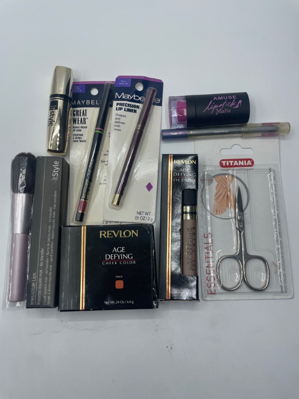 Photo 2 of Miscellaneous variety brand name cosmetics including (Titania, Maybelline, Revlon , It style & discontinued makeup products)