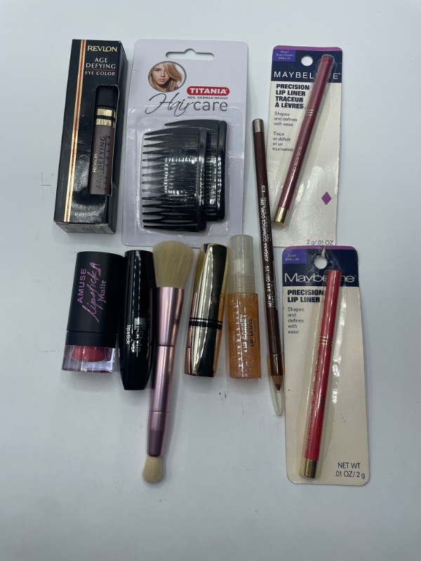 Photo 1 of Miscellaneous variety brand name cosmetics including (Maybelline, Revlon, It style, titania, & discontinued makeup products)