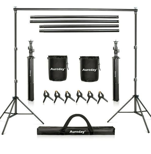 Photo 1 of Aureday Backdrop Stand, 7x10Ft Adjustable Photo Backdrop Stand Kit with 4 Crossbars, 6 Background Clamps, 2 Sandbags, and Carrying Bag for Parties/Wedding/Photography/Festival Decoration
