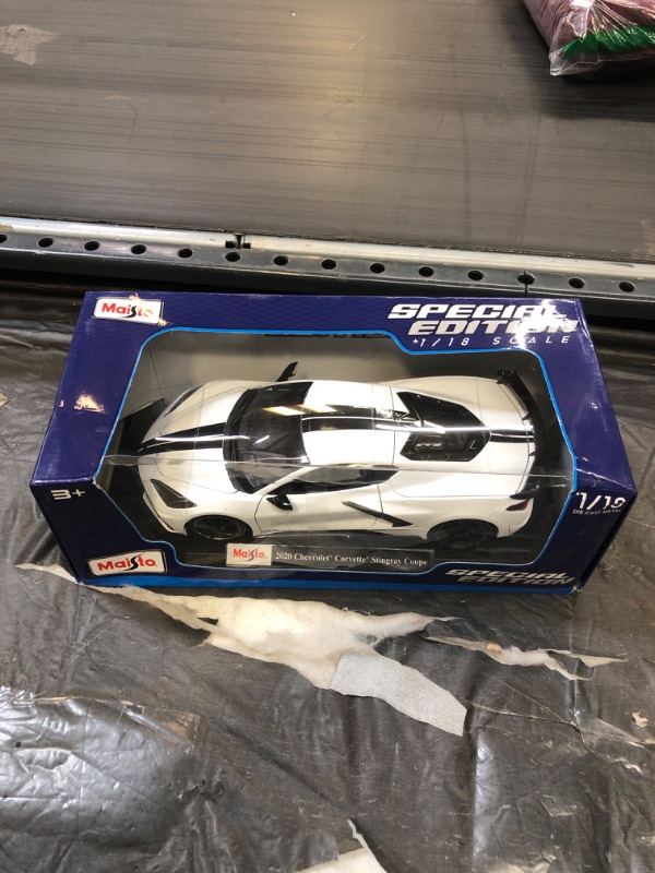 Photo 2 of Maisto 31455w High Wing White with Black Stripes 1 by 18 Diecast Model Car for 2020 Chevrolet Corvette Stingray C8 Coupe
