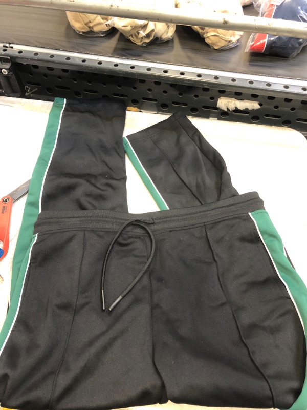 Photo 1 of ADULT GREEN AND BLACK TRACK SUIT ( SIZE: MED ) 