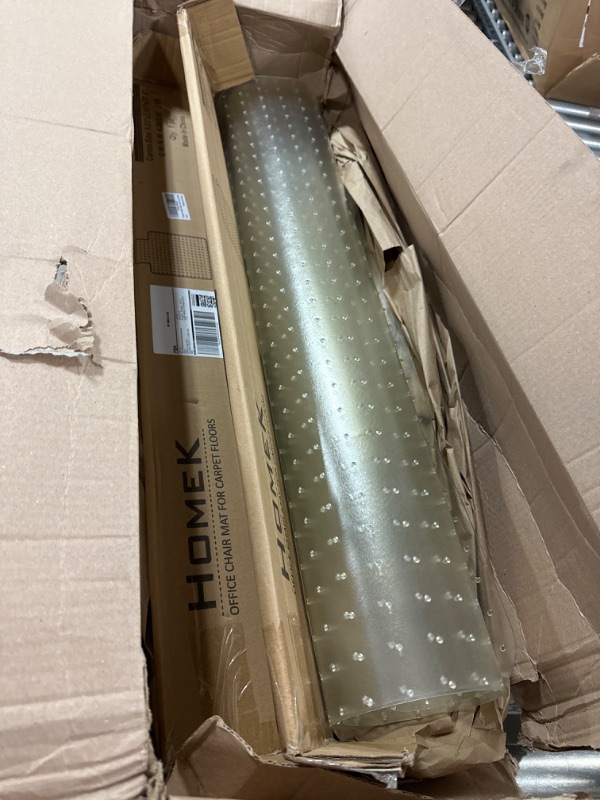 Photo 2 of Homek Office Chair Mat for Carpeted Floors - Clear Carpet Chair Mat with Lip 48”x 36”x 0.08” -- item is rolled up and needs to be unrolled--- box damaged due to transit and usage 