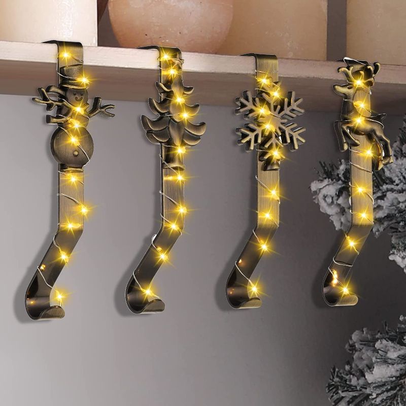 Photo 1 of 4 Sets Christmas Stocking Holders for Mantle Christmas Stocking Hanger Snowflake Reindeer Christmas Tree Snowman Stocking Hanger Xmas Stocking Hook with LED Light for Fireplace Mantle Decor(Bronze)
