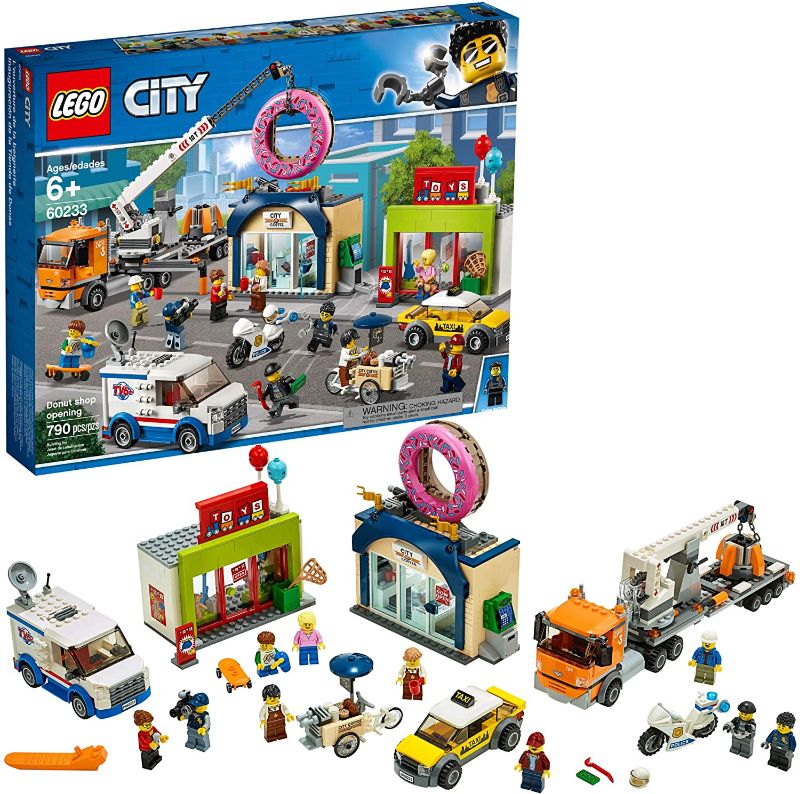 Photo 1 of LEGO City Donut Shop Opening 60233 Store Opening Build and Play with Toy Taxi, Van and Truck with Crane, Easy Build with Minifigures for Boys and Girls (790 Pieces)
