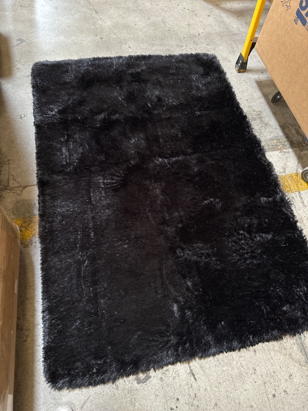 Photo 1 of 71X48 INCH BLACK FUZZY RUG 