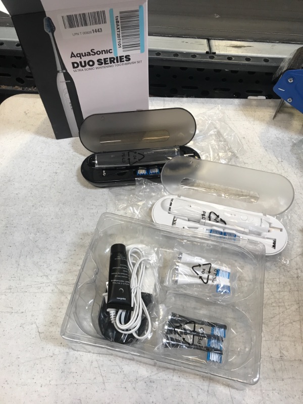 Photo 2 of Aquasonic Duo Dual Handle Ultra Whitening 40,000 VPM Wireless Charging Electric ToothBrushes - 3 Modes with Smart Timers - 10 Dupont Brush Heads & 2 Travel Cases Included