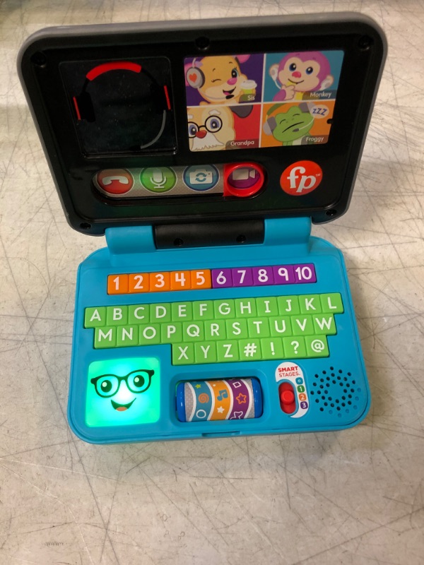 Photo 3 of Fisher-Price Pretend Laptop Learning Toy for Baby and Toddler with Light Music and Smart Stages Educational Content -- MINOR SCRATCHES --
