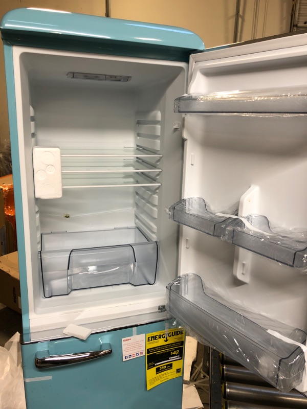 Photo 2 of Galanz  Retro Bottom Mount Refrigerator, Adjustable Mechanical Thermostat with True Freezer, Blue, 7.4 Cu Ft HAS A SMALL DENT ON BACK SIDE ON BOTTOM 

