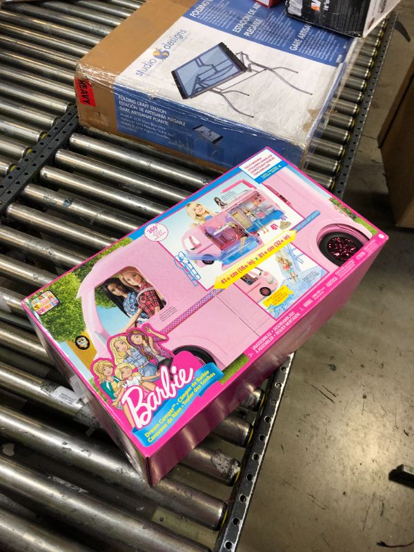 Photo 2 of Barbie Camper, Doll Playset with 50 Accessories, Includes Waterslide, 2 Hammocks, Canopy Bed & Fireplace, Dream Camper
