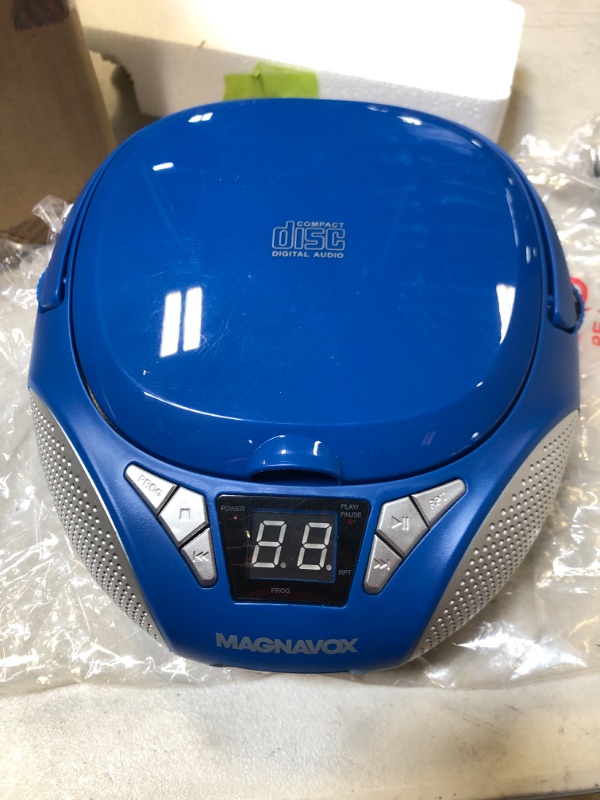 Photo 2 of Magnavox MD6924-BL Portable Top Loading CD Boombox with AM/FM Stereo Radio in Blue CD-R/CD-RW Compatible LED Display AUX Port Supported Programmable CD Player