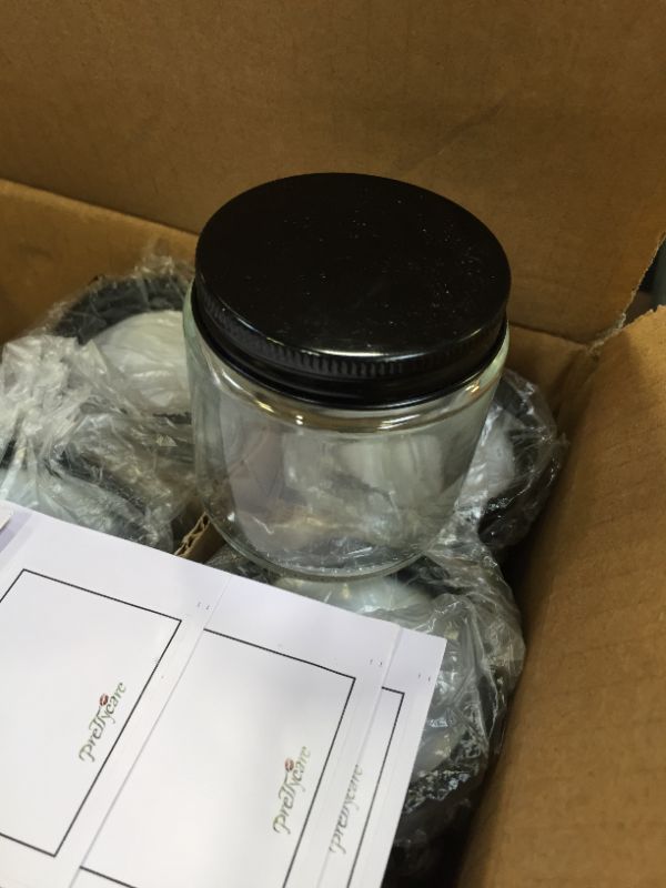 Photo 1 of 24 PACK OF SMALL GLASS JARS