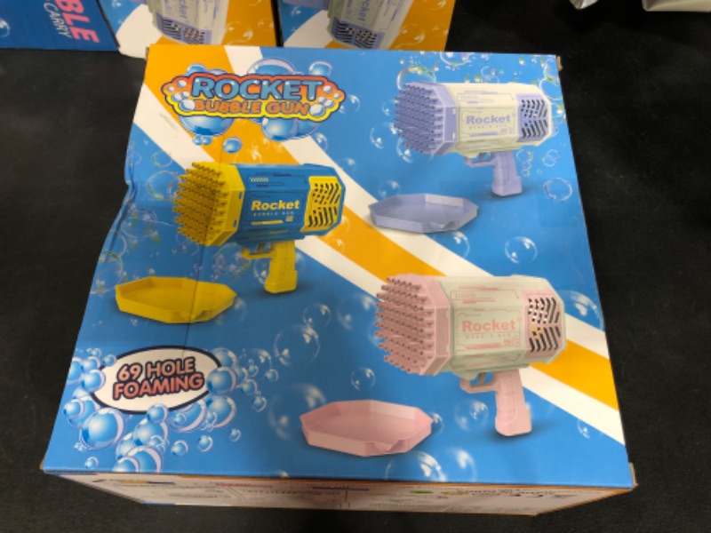 Photo 1 of Blue Bubble Machine, 69 Holes Rocket Bubble Maker,Bubbles for Kids Christmas Toys for Boys Girls Age 3 4 5 6 7 8 9 10 11 12 Year Old, Bubble Solution Toys Gifts for Outdoor Birthday Wedding Party