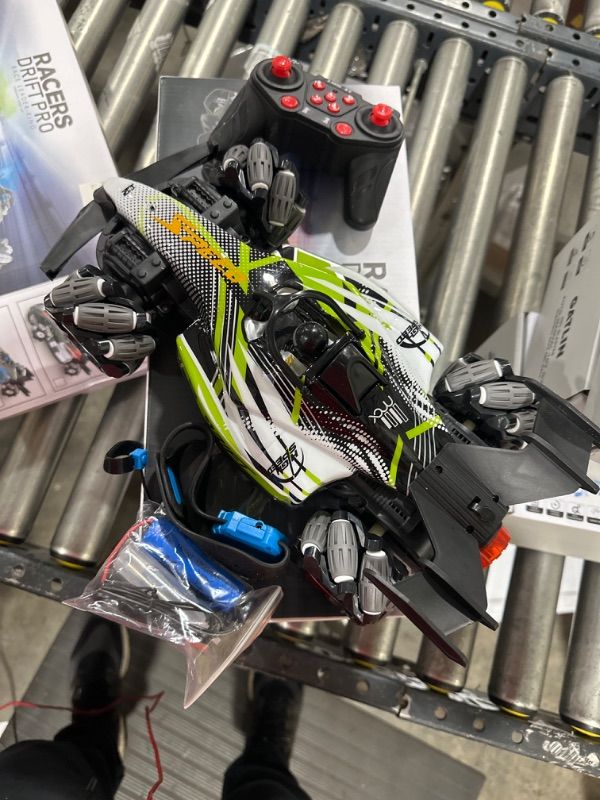 Photo 1 of Axirata F1 Gesture Hand Remote Control Car for Kids Age 6-12 Year Old 2.4GHz 4WD 360°Rotation Drift RC Stunt Car with Light & Music & Spray 1:12 Scale Toy Car for Boys Girls

