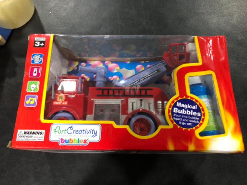 Photo 1 of ArtCreativity Bubble Blowing Fire Engine Toy Truck for Kids - Awesome Light Up LED and Siren Effects - Bubble Solution with Funnel Included - Best Birthday Gift for Boys and Girls 5+