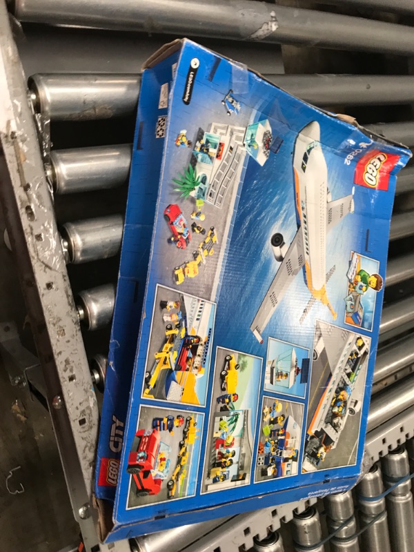 Photo 2 of LEGO City Passenger Airplane 60262, with Radar Tower, Airport Truck with a Car Elevator, Red Convertible, 4 Passenger and 4 Airport Staff Minifigures, plus a Baby Figure (669 Pieces)