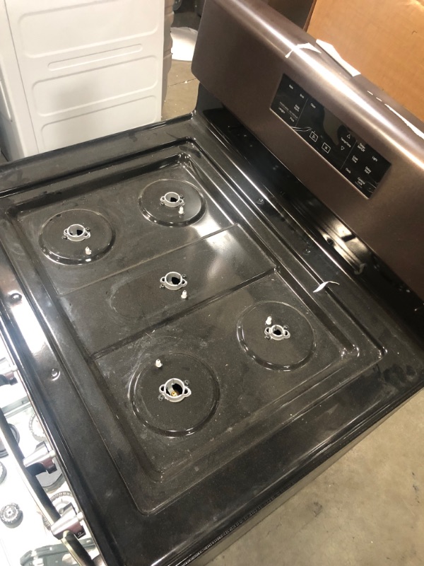 Photo 8 of Whirlpool 5.0 cu. ft. Gas Range with Self Cleaning and Center Oval Burner in Black Stainless