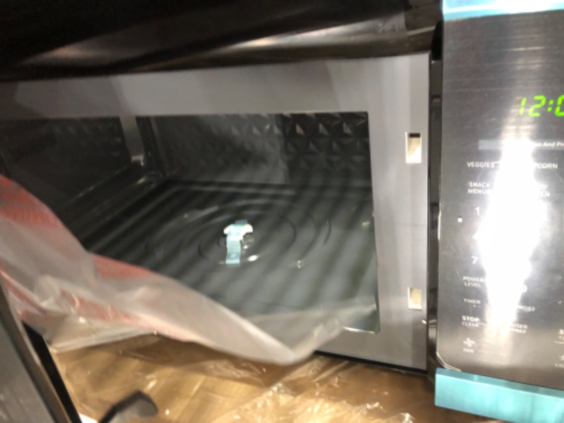 Photo 4 of 1.7 cu. ft. 1000-Watt Over the Range Microwave in Stainless Steel