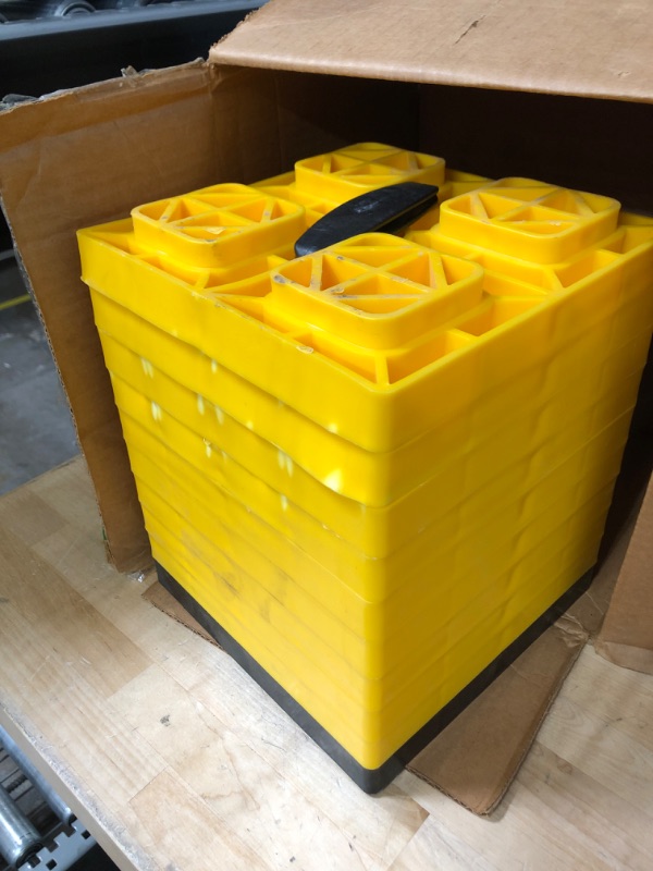 Photo 2 of Camco Fasten 2x2 Leveling Block for Single Tires-Interlocking Design Allows Stacking to Desired Height-Includes Secure T-Handle Carrying System-Yellow-10 Pack (21022) Yellow Single Tire Ships In Own Container