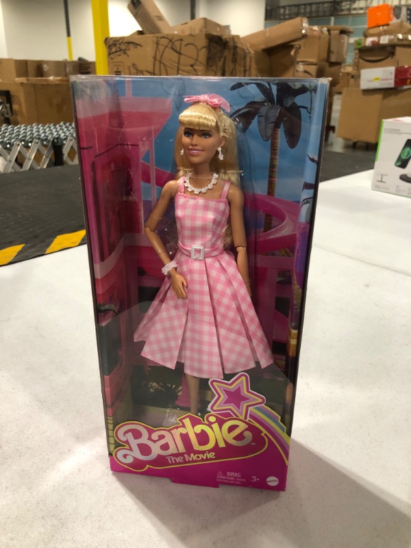 Photo 2 of Barbie The Movie Doll, Margot Robbie as Barbie, Collectible Doll Wearing Pink and White Gingham Dress with Daisy Chain Necklace