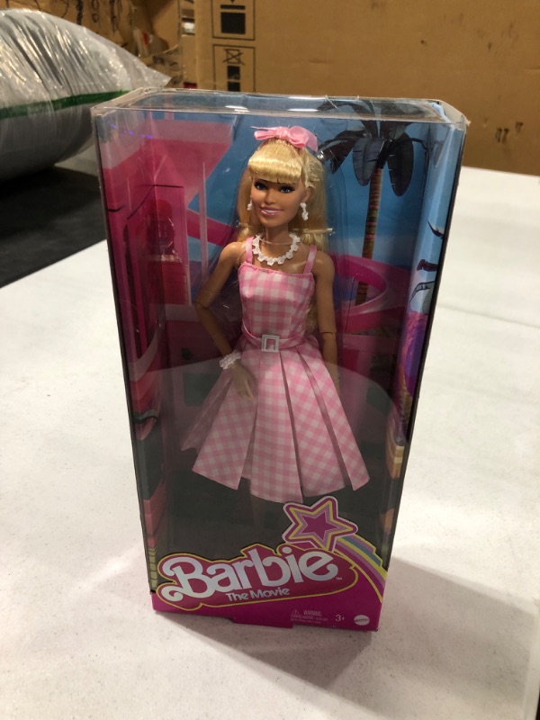 Photo 2 of Barbie The Movie Doll, Margot Robbie as Barbie, Collectible Doll Wearing Pink and White Gingham Dress with Daisy Chain Necklace