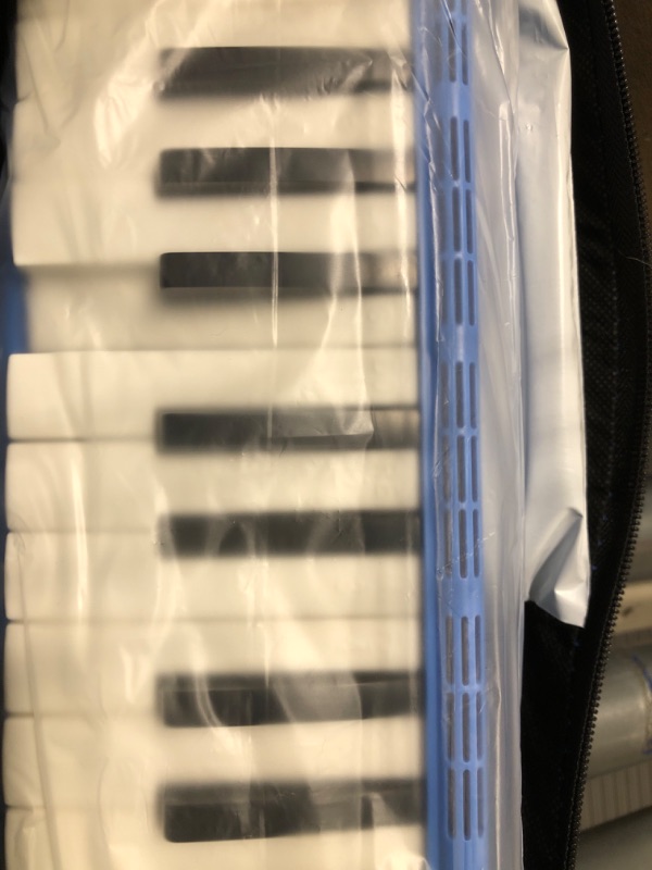 Photo 1 of CAHAYA Melodica 2 Double Mouthpieces Tube Sets Melodicas Piano Style 32 Key Portable with Carrying Bag
