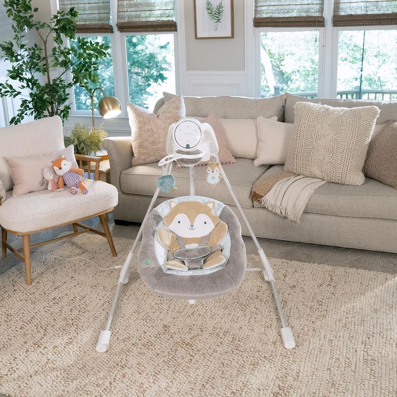 Photo 1 of Ingenuity InLighten 5-Speed Baby Swing - Swivel Infant Seat, 5 Point Safety Harness, Nature Sounds, Lights - Kitt
