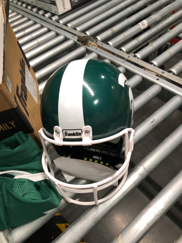 Photo 4 of Franklin Sports NCAA Kids Football Helmet + Jersey Sets - College Uniform + Helmet Sets for Boys & Girls-Toy Kids Costume Set Michigan State Spartans