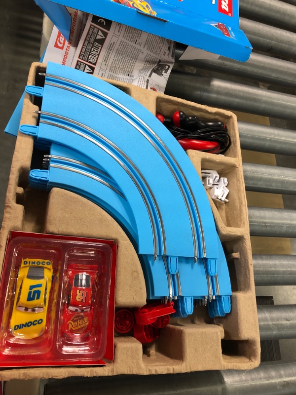 Photo 1 of Carrera First Disney/Pixar Cars - Slot Car Race Track - Includes 2 Cars: Lightning McQueen and Dinoco Cruz - Battery-Powered Beginner Racing Set for Kids Ages 3 Years and Up Disney Cars w/ Spinners