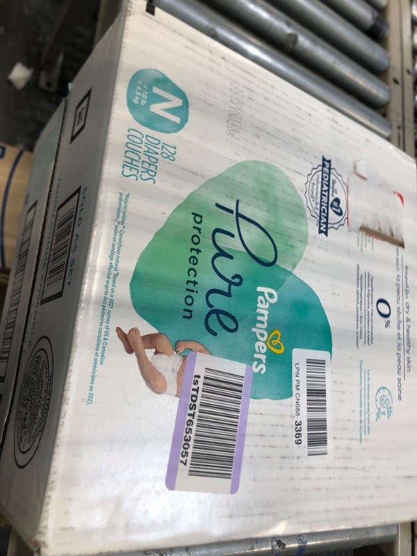 Photo 2 of Diapers Size 0, 128 Count - Pampers Pure Protection Disposable Baby Diapers, Hypoallergenic and Unscented Protection, Enormous Pack (Packaging & Prints May Vary) Size 0 (128 Count) ONE Month Supply