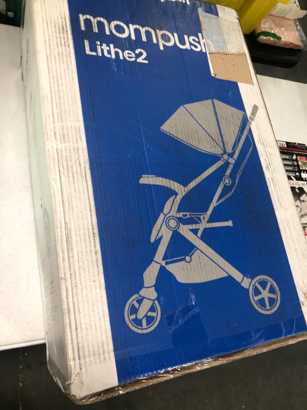 Photo 1 of Mompush Lithe V2 Lightweight Stroller + Snack Tray, Ultra-Compact Fold & Airplane Ready Travel Stroller, Near Flat Recline Seat, Cup Holder, Raincover & Travelbag Included Navy