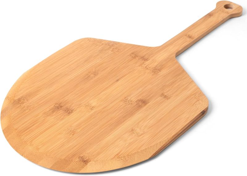 Photo 1 of Azlan's Essentials Wood Pizza Peel 16 Inch - Sustainably Sourced Wooden Bamboo Pizza Paddle with Ergonomic Handle For Baking Homemade Pizza and Bread, No Split or Cracks, Extra Large.
