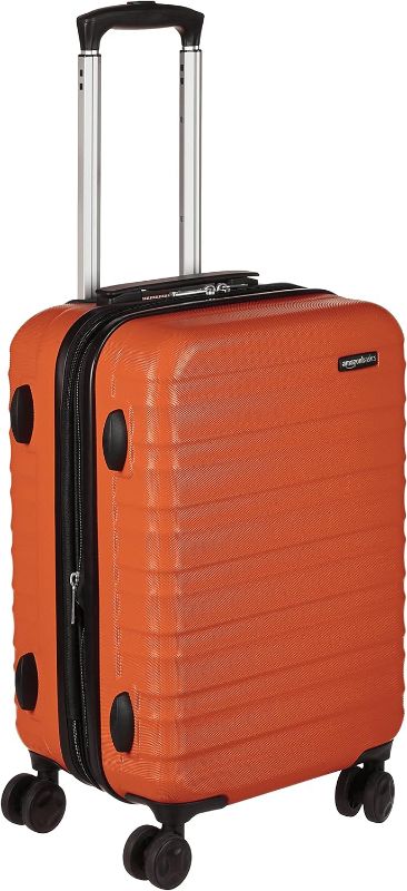 Photo 1 of Amazon Basics 20-Inch Hardside Spinner, Orange in Carry-On Luggage by Amazon Basics