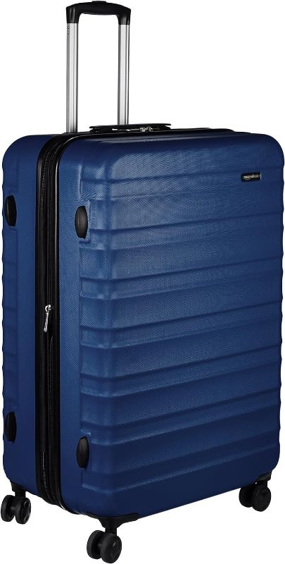 Photo 1 of ***LINING INSIDE IS DAMAGED*** Amazon Basics 28-Inch Hardside Spinner, Navy Blue
