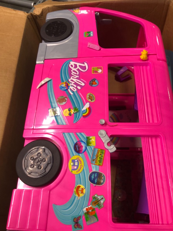 Photo 4 of Barbie Camper Playset, Dreamcamper Toy Vehicle with 60 Accessories Including Furniture, Pool and 30-Inch Slide