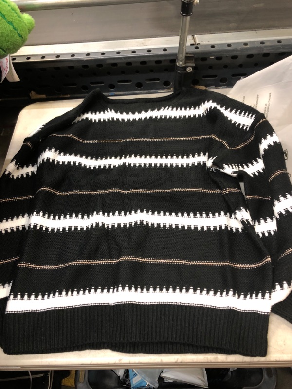 Photo 1 of BLACK AND WHITE LONG SLEEVE SWEATER ( SIZE: SMALL ) 